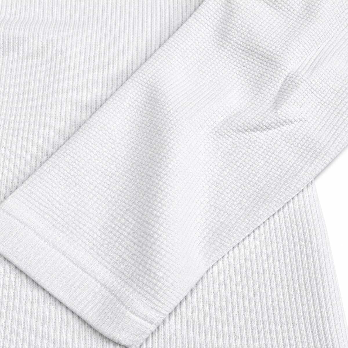 Maille gaufrée blanche et finition de manche du maillot JT Racing Waffle