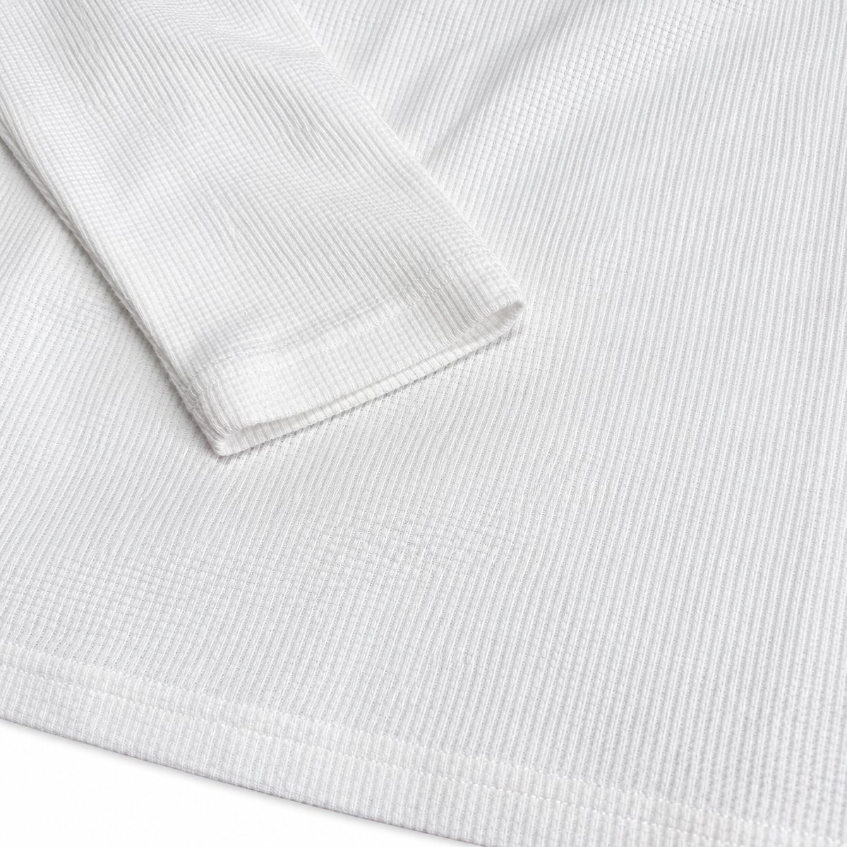 Détail des ourlets et du tissu gaufré du maillot JT Racing Waffle Classic white